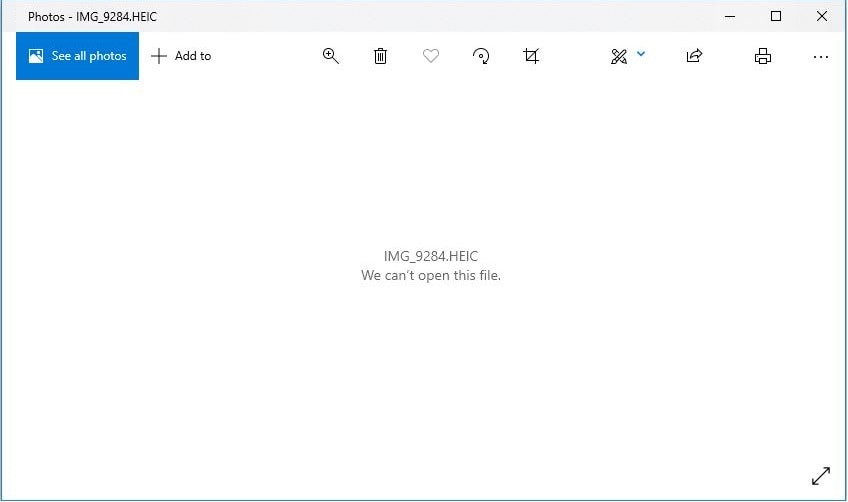 Screenshot of Windows Photos app showing HEIC file not supported error